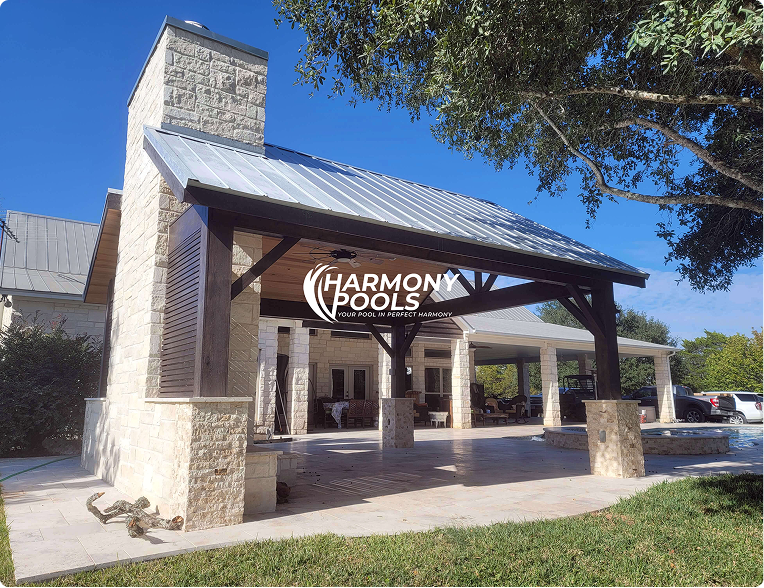 Harmony Pools storefront with stone entrance, covered patio, and blue sky