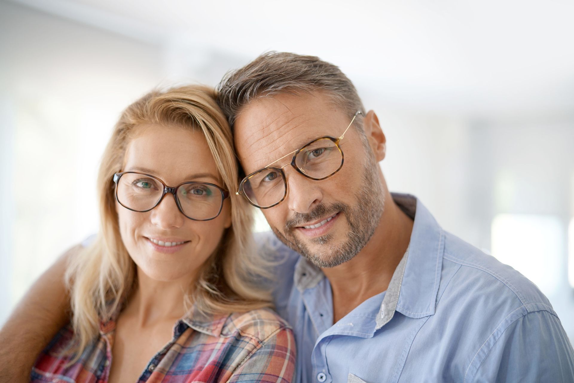 Doctor holding eyeglasses.