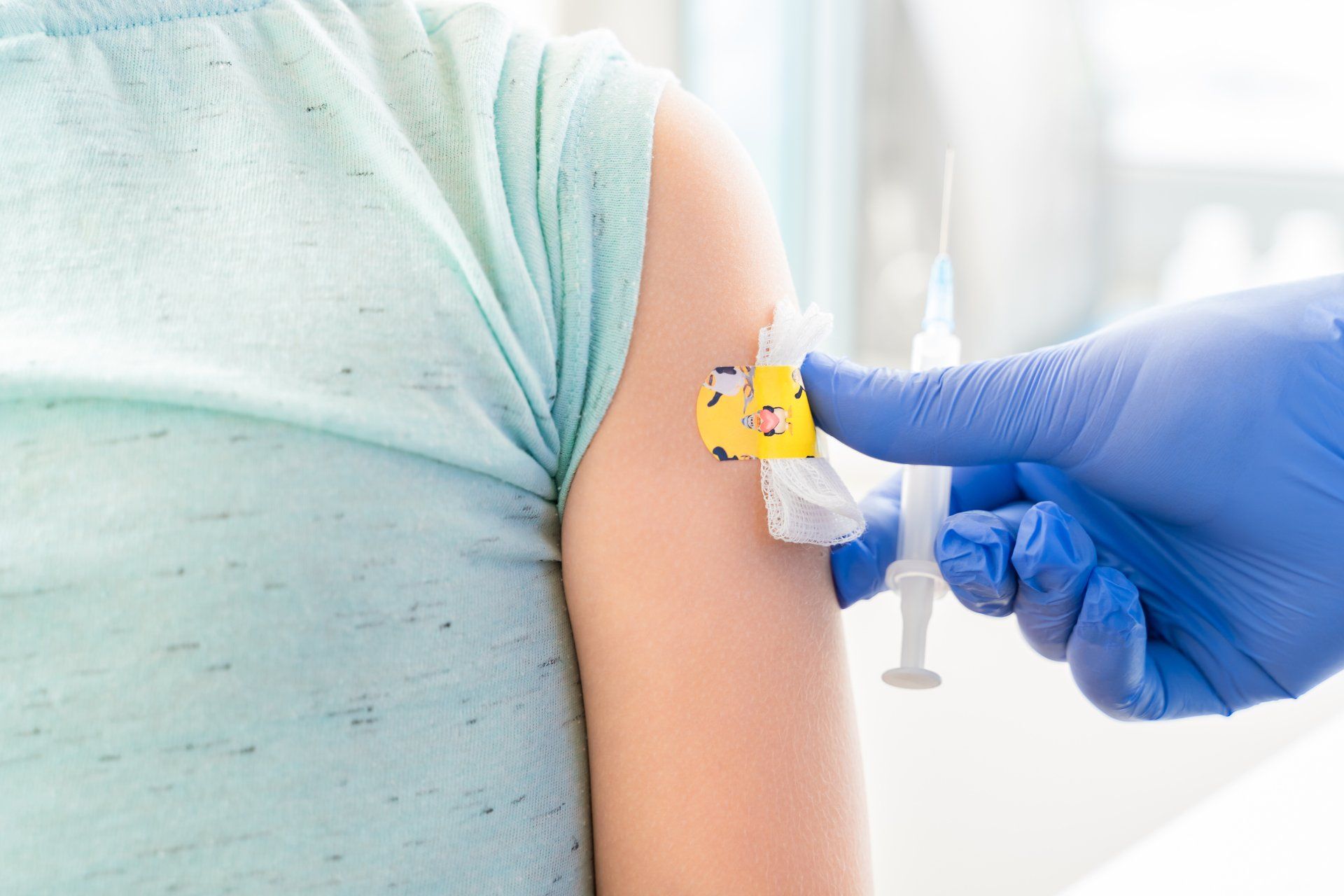 A person is getting a vaccine in their arm.