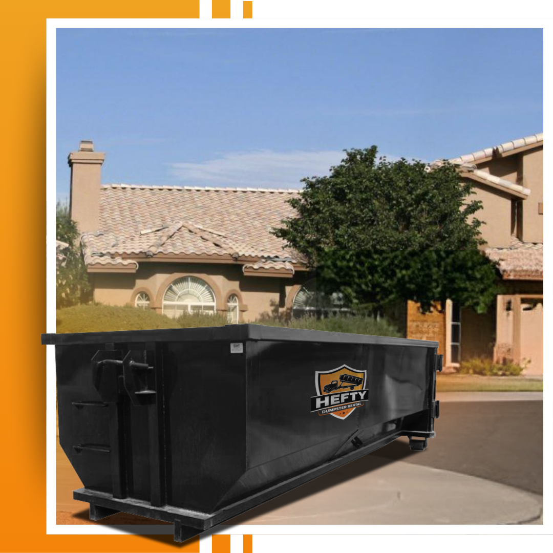 A dumpster placed in front of a house