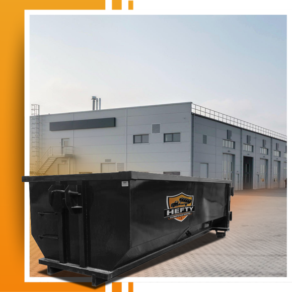 A dumpster placed in front of a building
