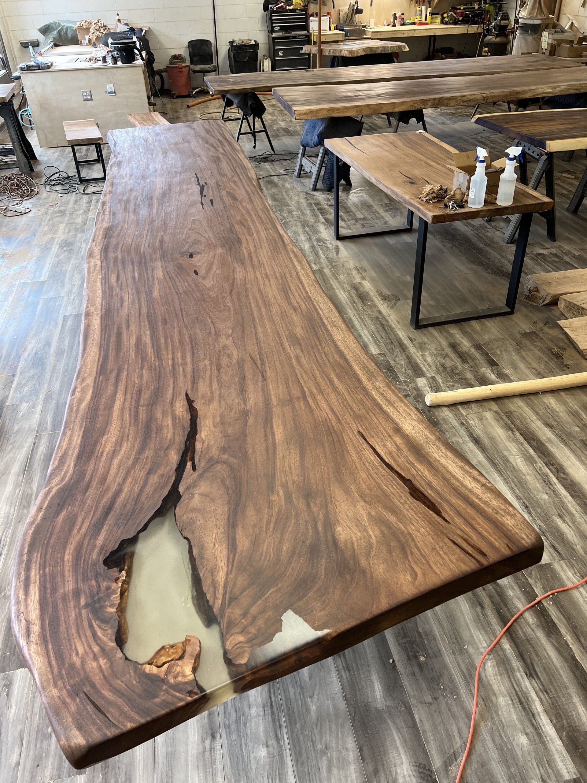 A wooden table is sitting on top of a wooden floor in a room.