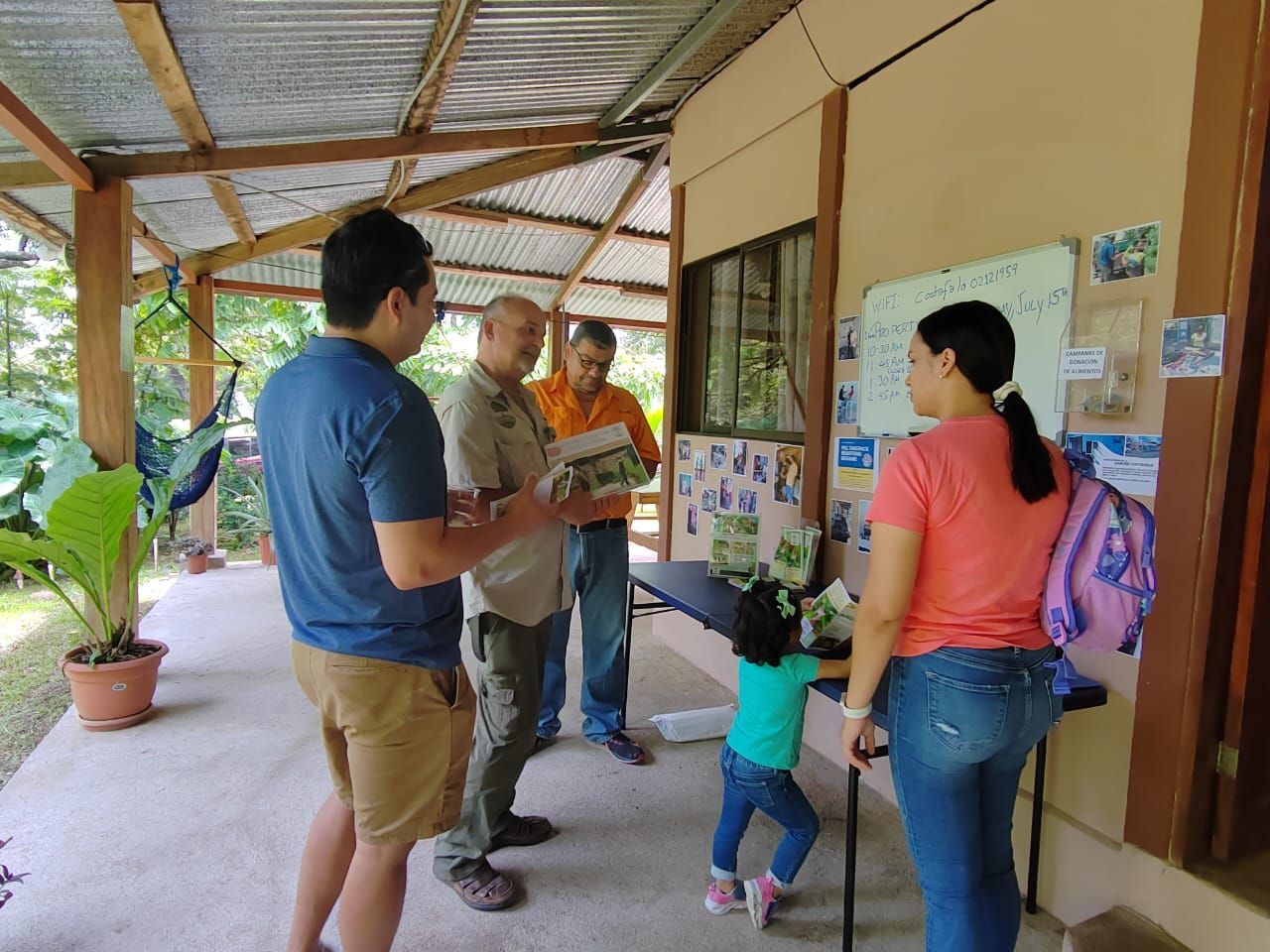 A group of people are standing in front of a building.