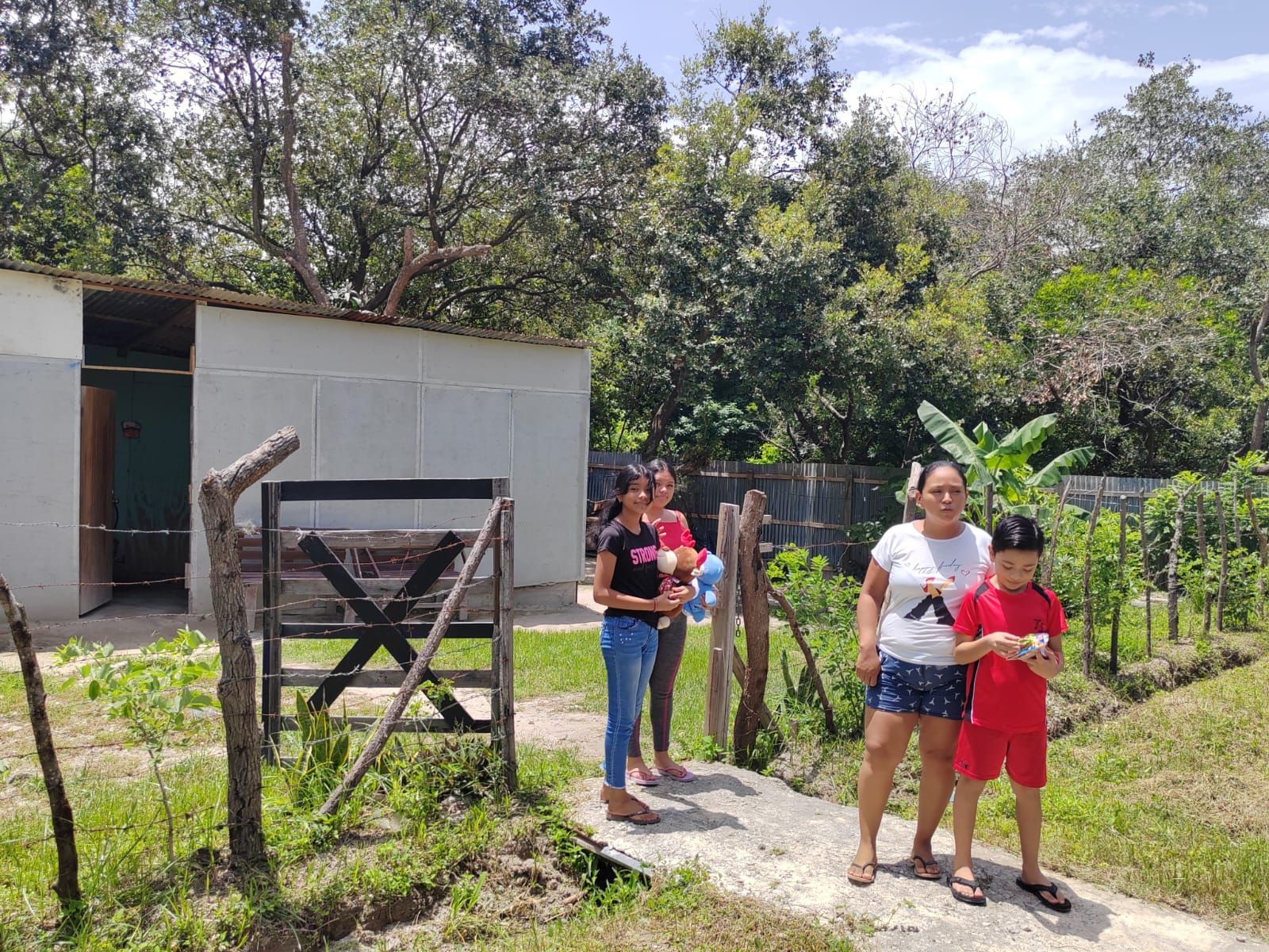 A group of people are standing in front of a building.