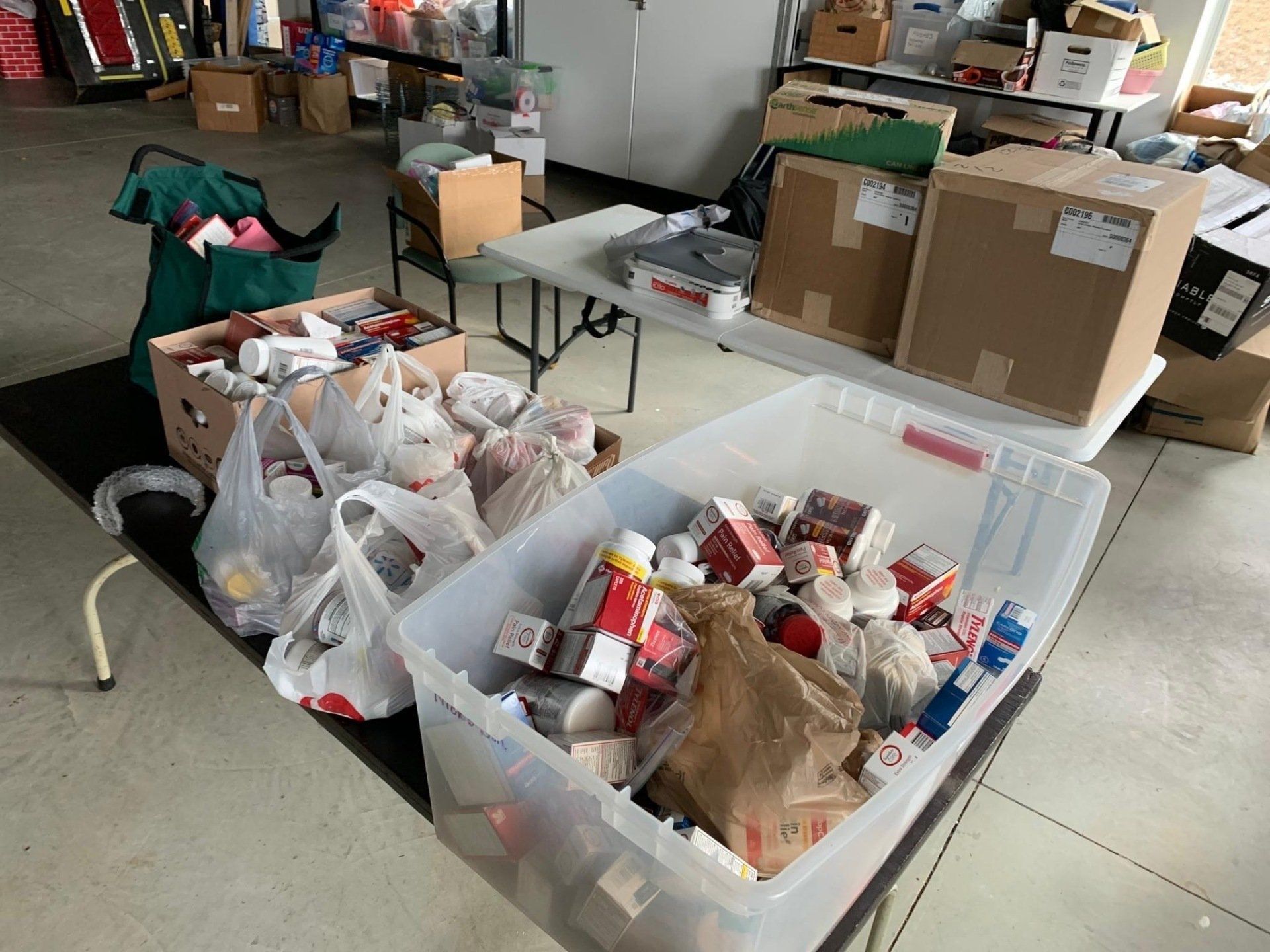 A room filled with lots of boxes and plastic bags.