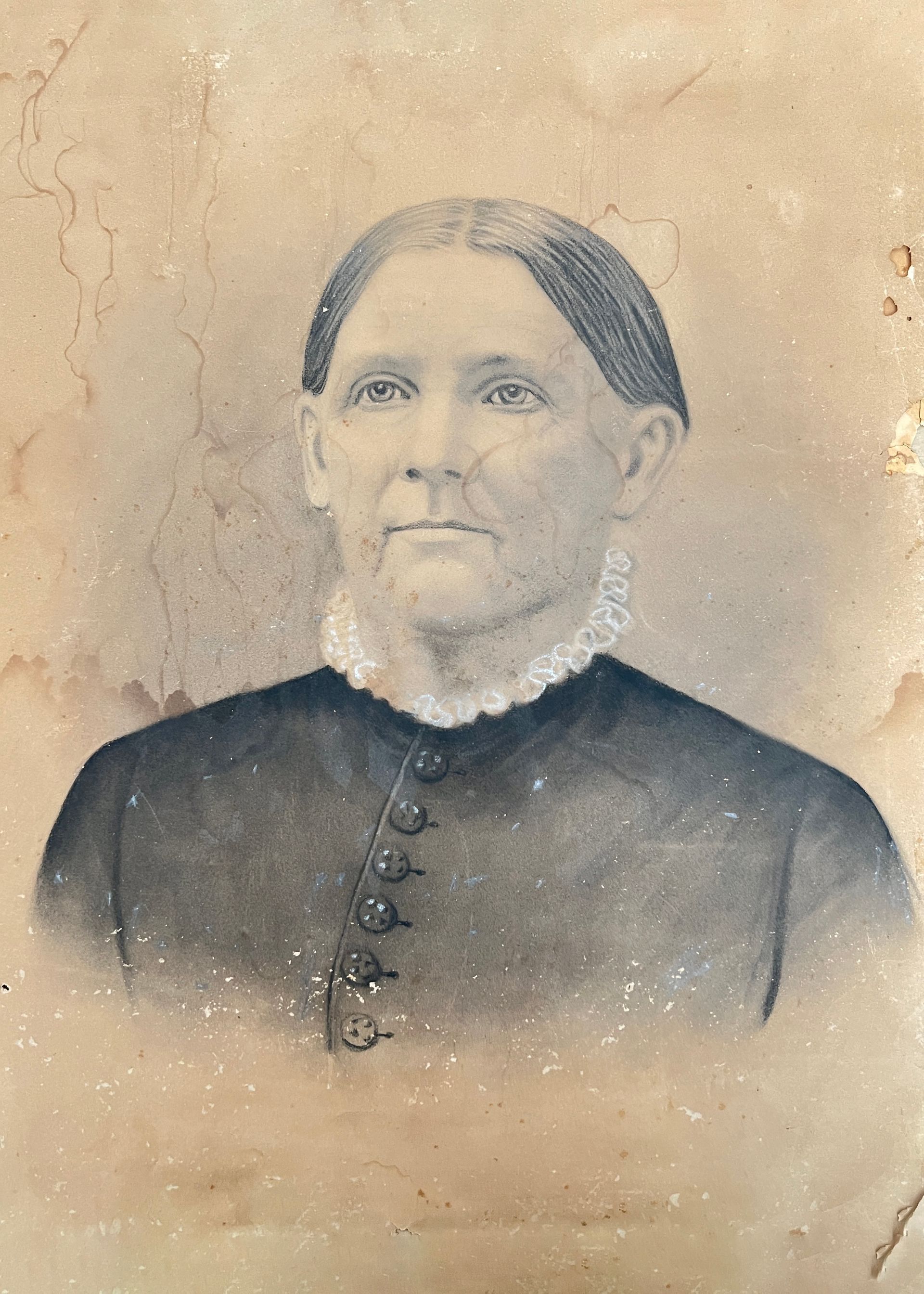 A black and white photo of a woman in a black dress