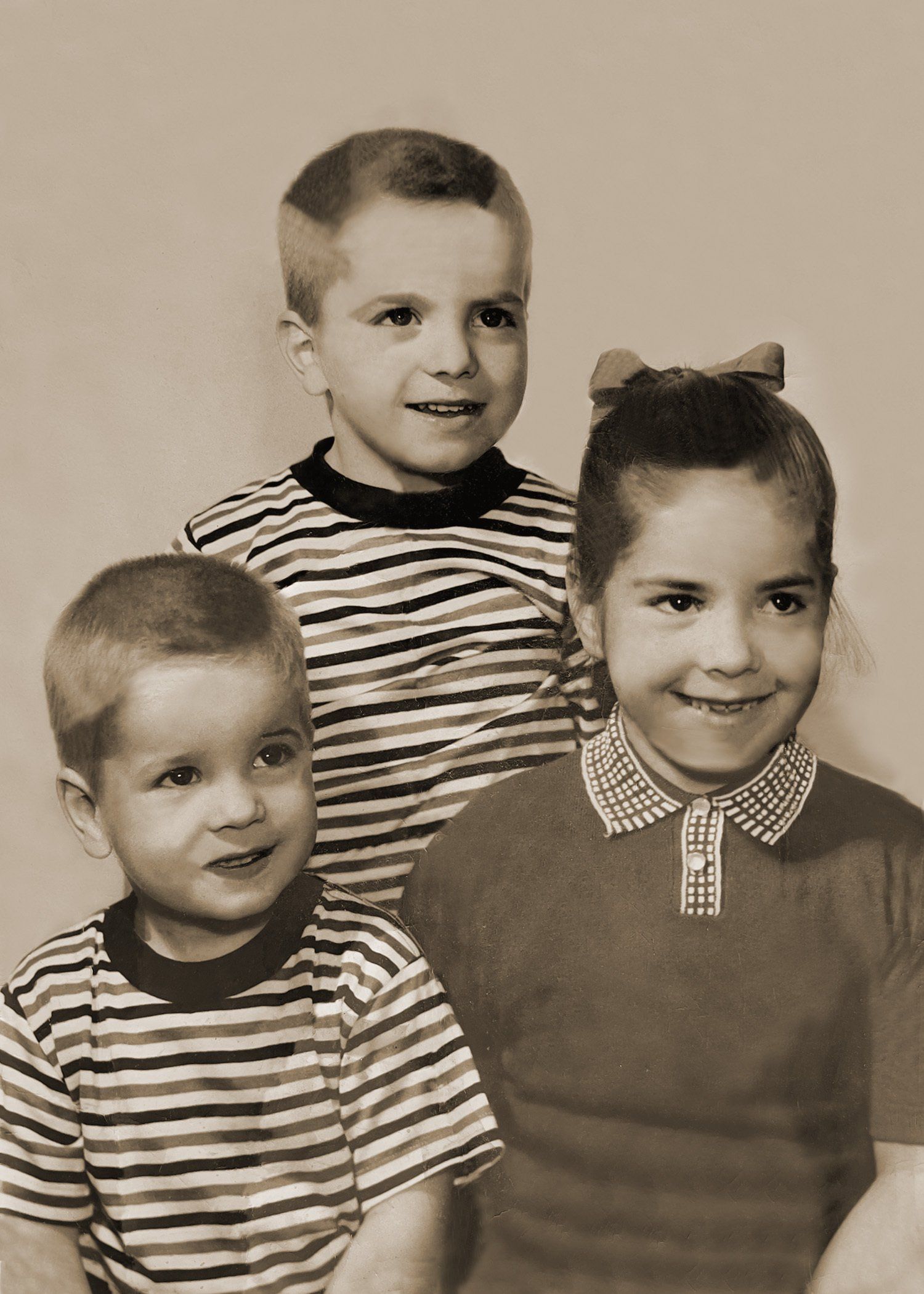 A boy and a girl are posing for a picture together