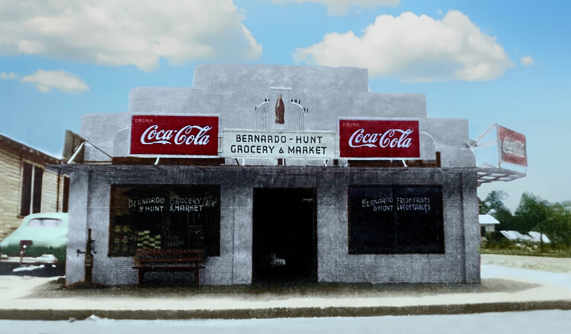 A coca cola store with a car parked in front of it