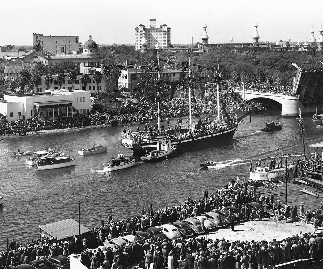 A black and white photo of boats in a river