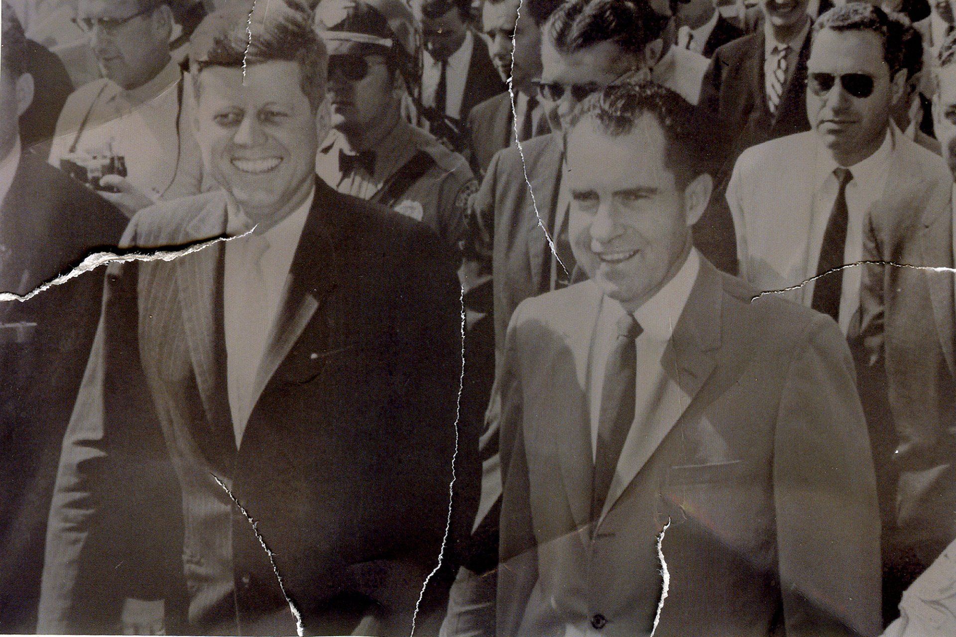 A black and white photo of two men in suits and ties