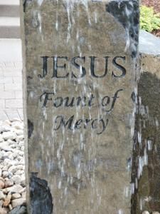 A stone water fountain engraved with 