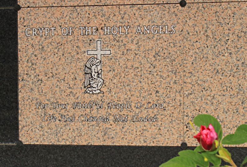 A granite crypt plaque titled 