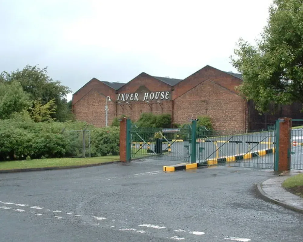 A brick building with the word paper house on it