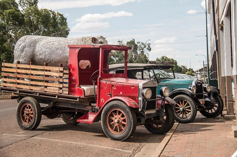 Two old trucks are parked next to each other on the side of the road — G & D Ross Bus Charters In Magnolia, QLD