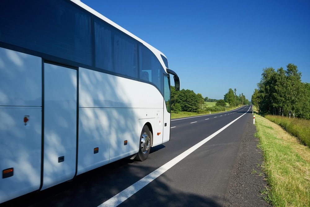 A White Private Tour Bus