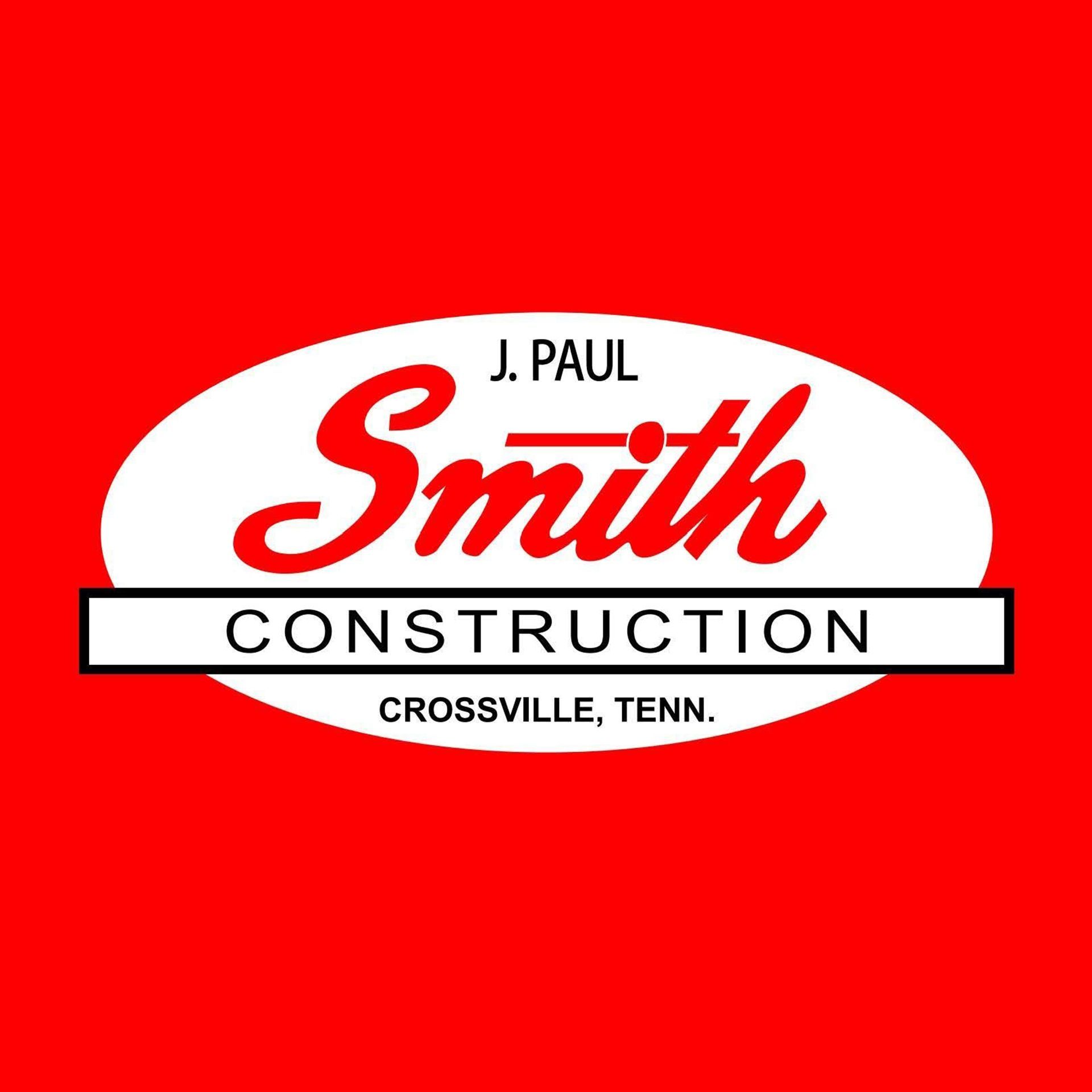 J. Paul Smith Construction logo on a red background, with white oval and black banner, Crossville, Tenn.