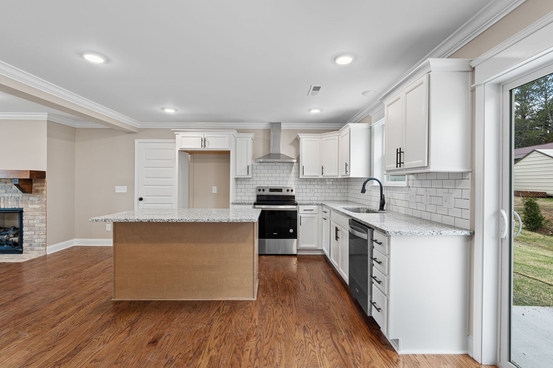 There is a large island in the middle of the kitchen.