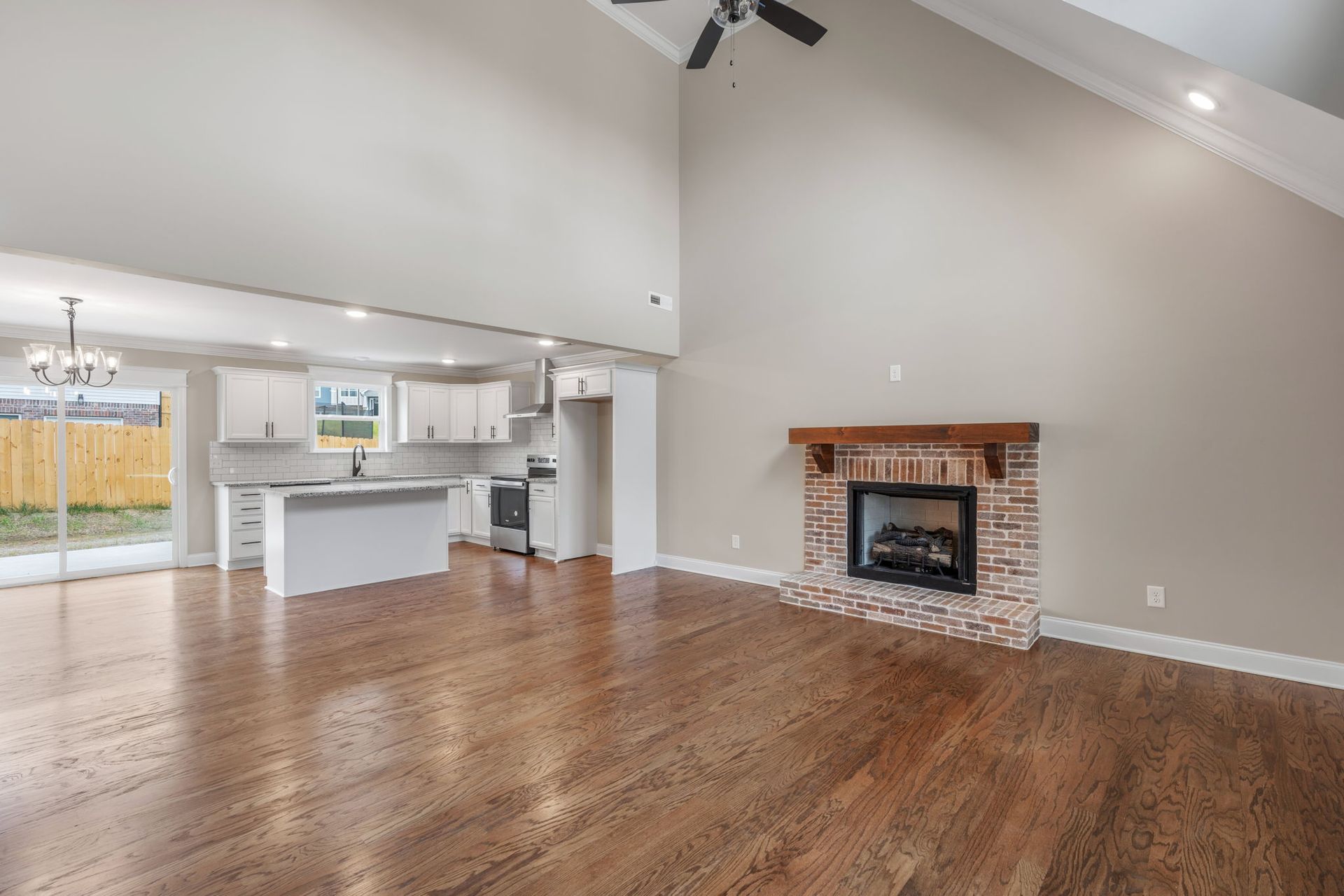 There is a fireplace in the middle of the living room.