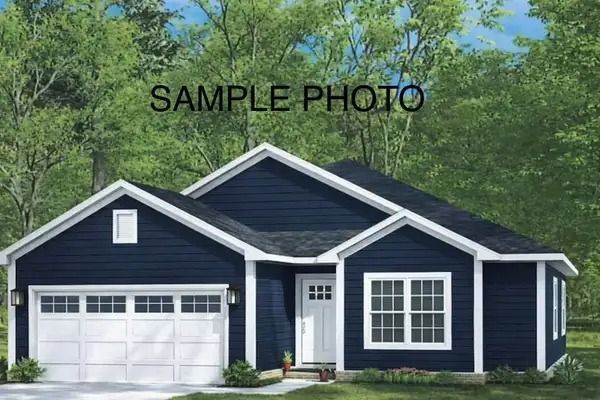 Dark blue single-story house with white trim, garage, and trees in the background