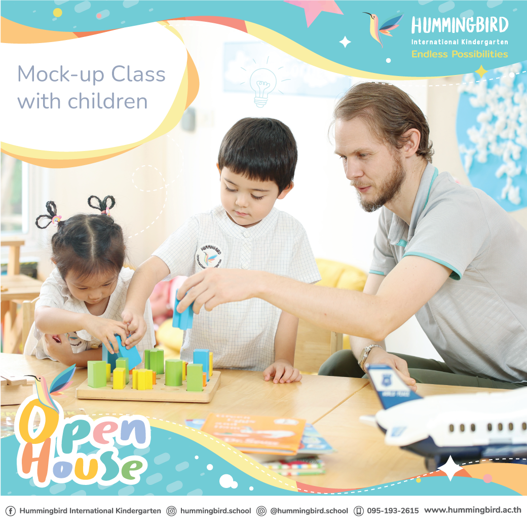 A man and two children are sitting at a table playing with blocks.