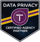 A shield-shaped badge with dark purple, yellow, and white text reading