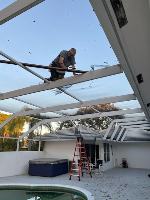 A Man Fixing A Screen | Lantana, Florida, United States | Phoenix Screen Company