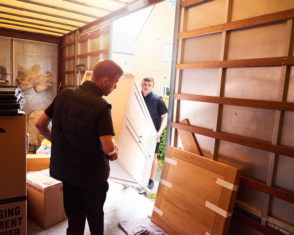 Worker Loading Furniture into Truck — Worthington, MN — Schaap Moving & Storage