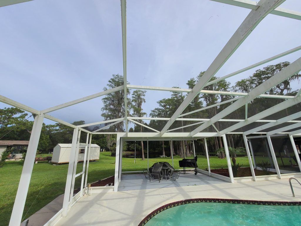 Pool enclosure pressure washing — Apollo Beach, FL — EGA Parking Lot Striping & Pressure Washing