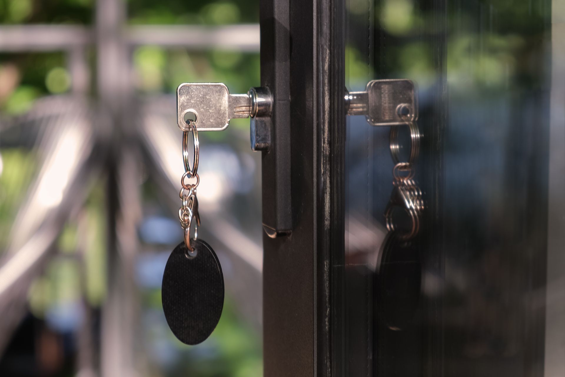 Key with a large oval keychain is inserted into the keyhole.