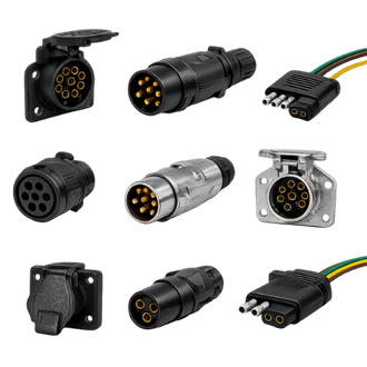Assorted round automotive electrical connectors in black, silver, and gray on a white background