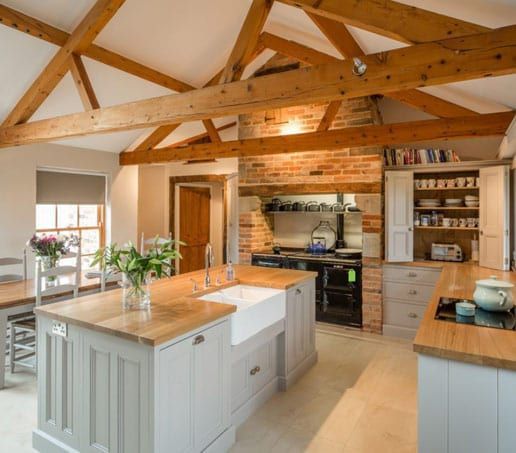 A kitchen with a large island and a sink