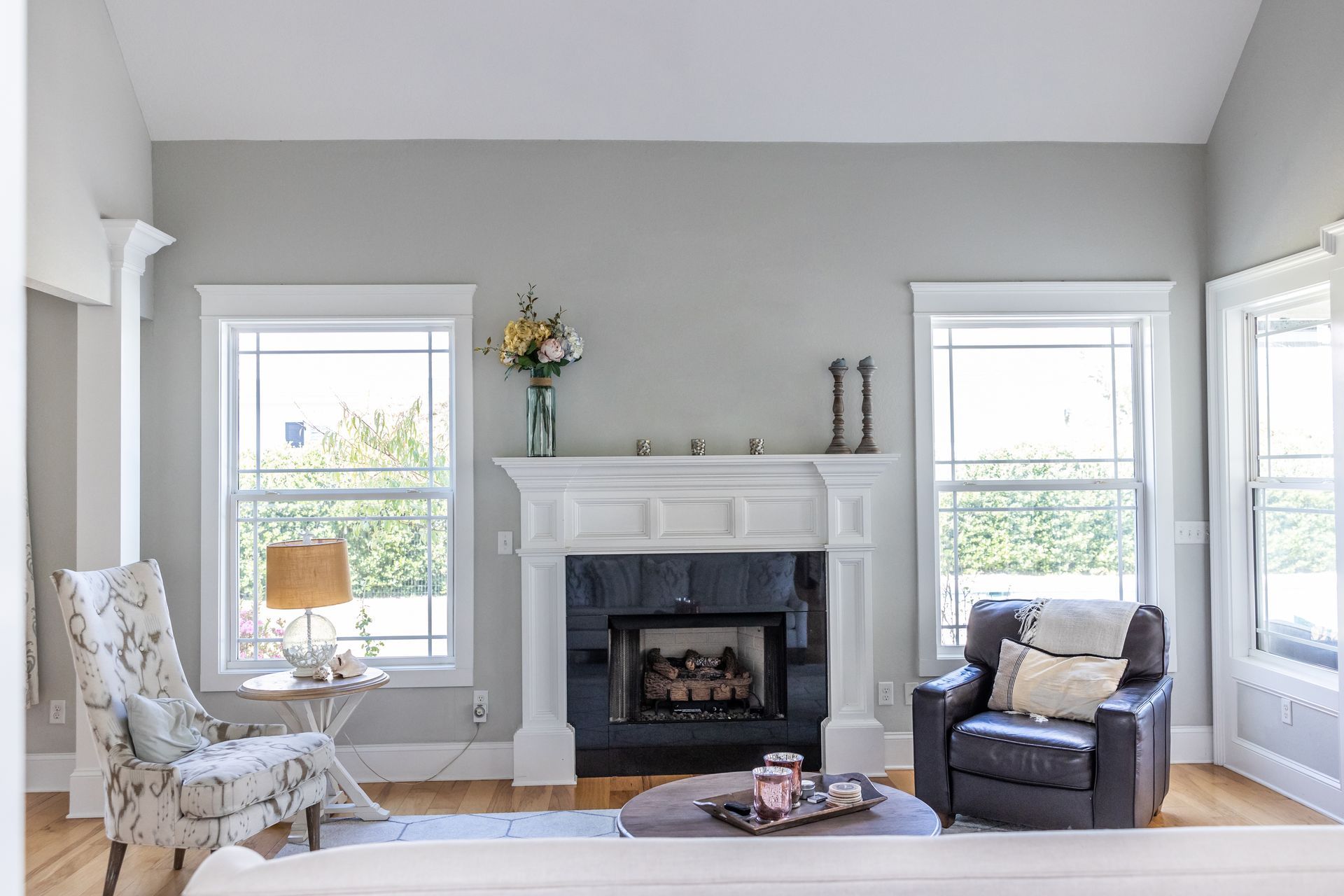 Bright renovated living room with large windows and natural light