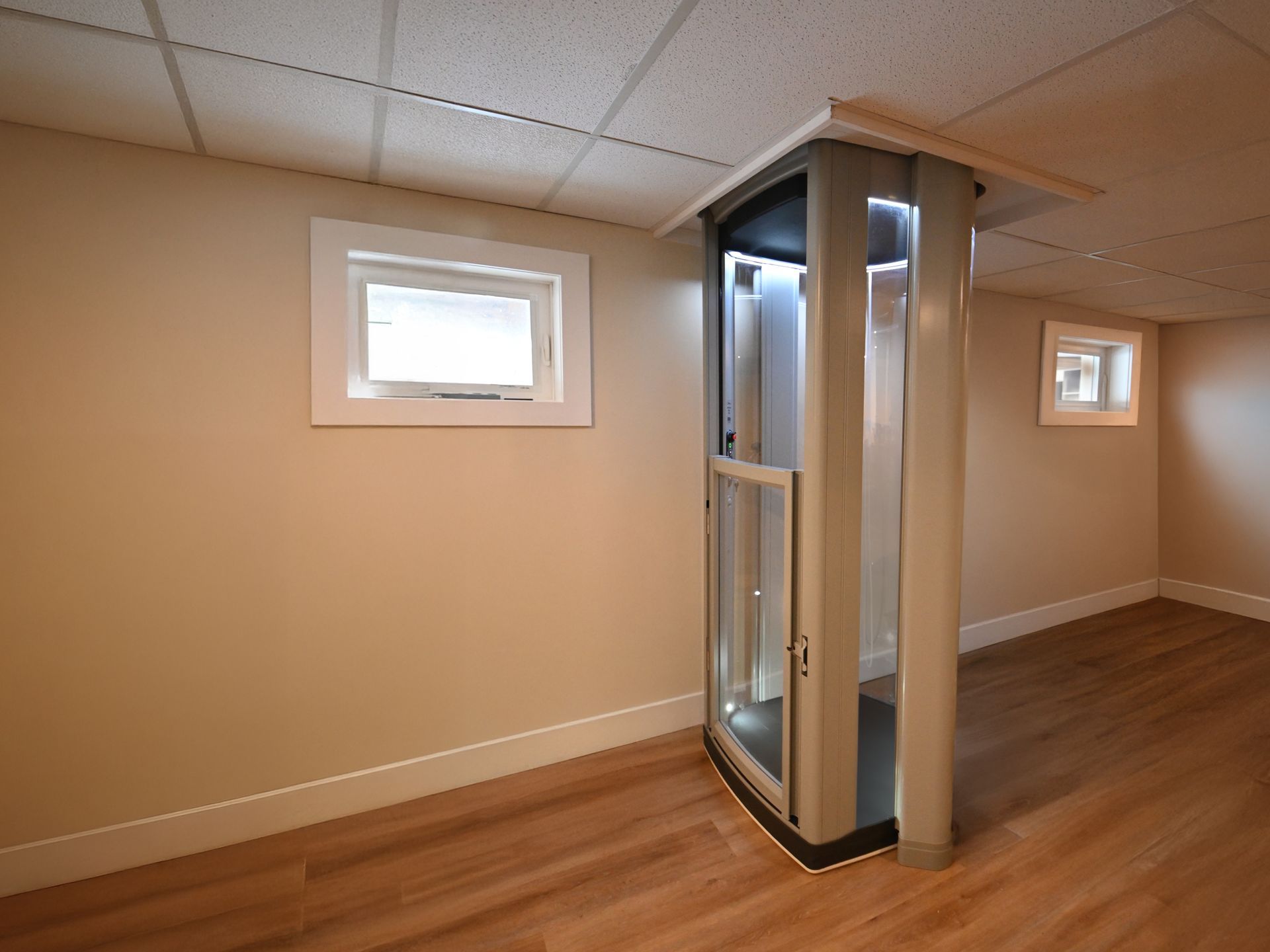 There is a elevator in the corner of the room.