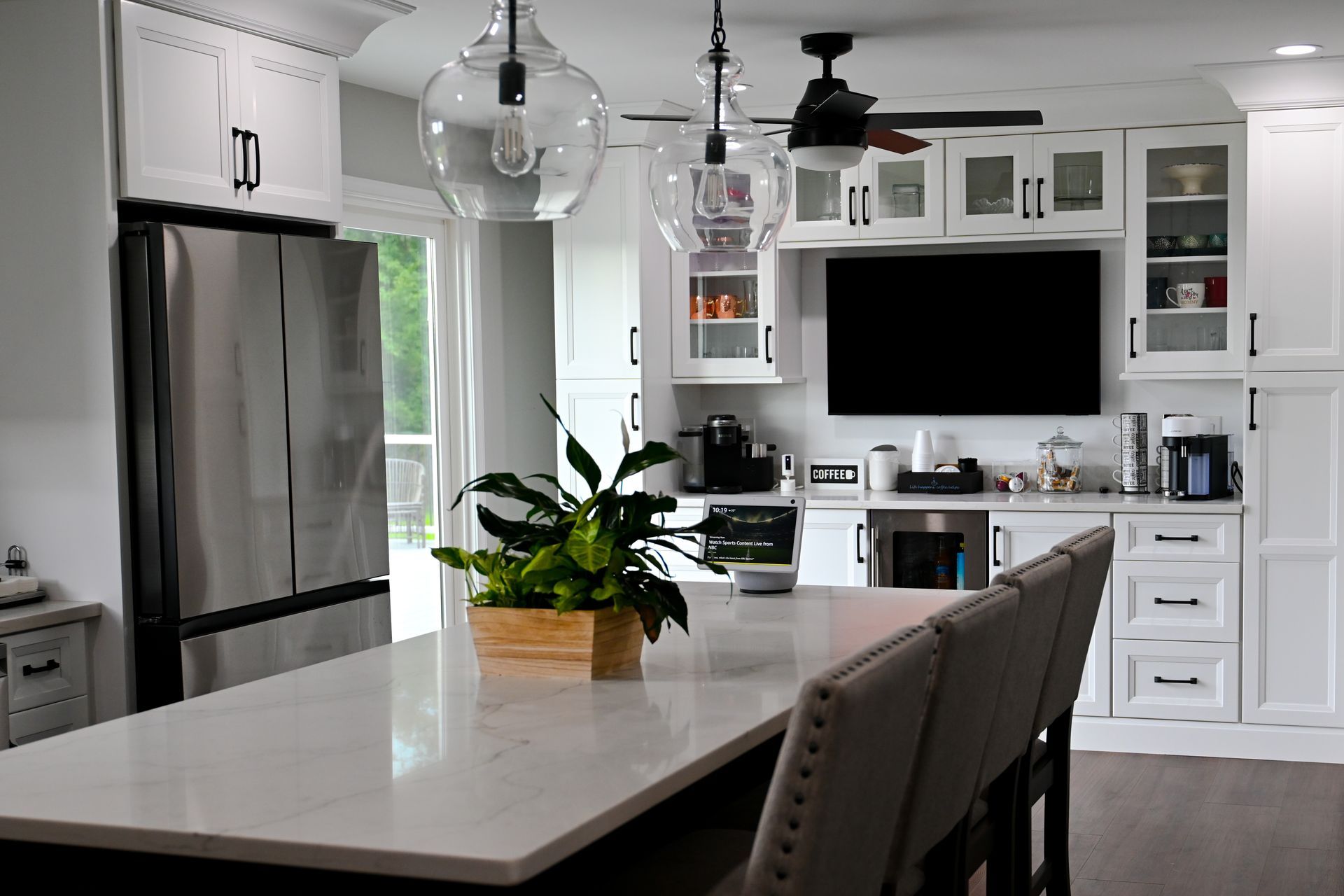 A kitchen with gray cabinets and a stainless steel dishwasher A kitchen with gray cabinets and a stainless steel dishwasher