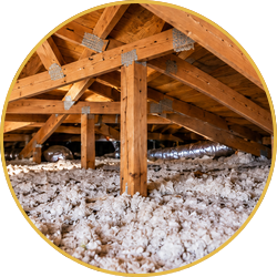Attic insulation with exposed wooden rafters and beams under a roof