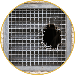 Damaged metal mesh screen with a large hole near the right side