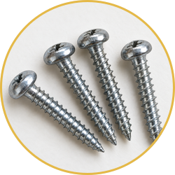 Four silver screws arranged in a circle on a white background