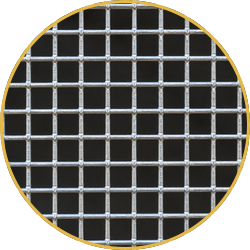 Circular metal wire mesh grid with a yellow rim on a black background