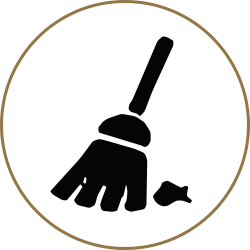 Black broom icon inside a tan circle with a small spilled debris mark