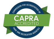 CAPRA Accredited seal featuring a blue circular border with text and a green banner reading