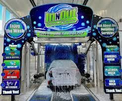A car is being washed in a car wash.
