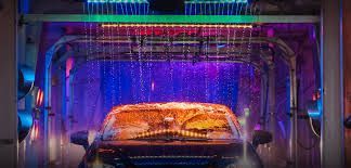 A car is being washed in a car wash.