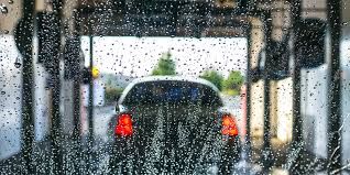 A car is being washed in a car wash.