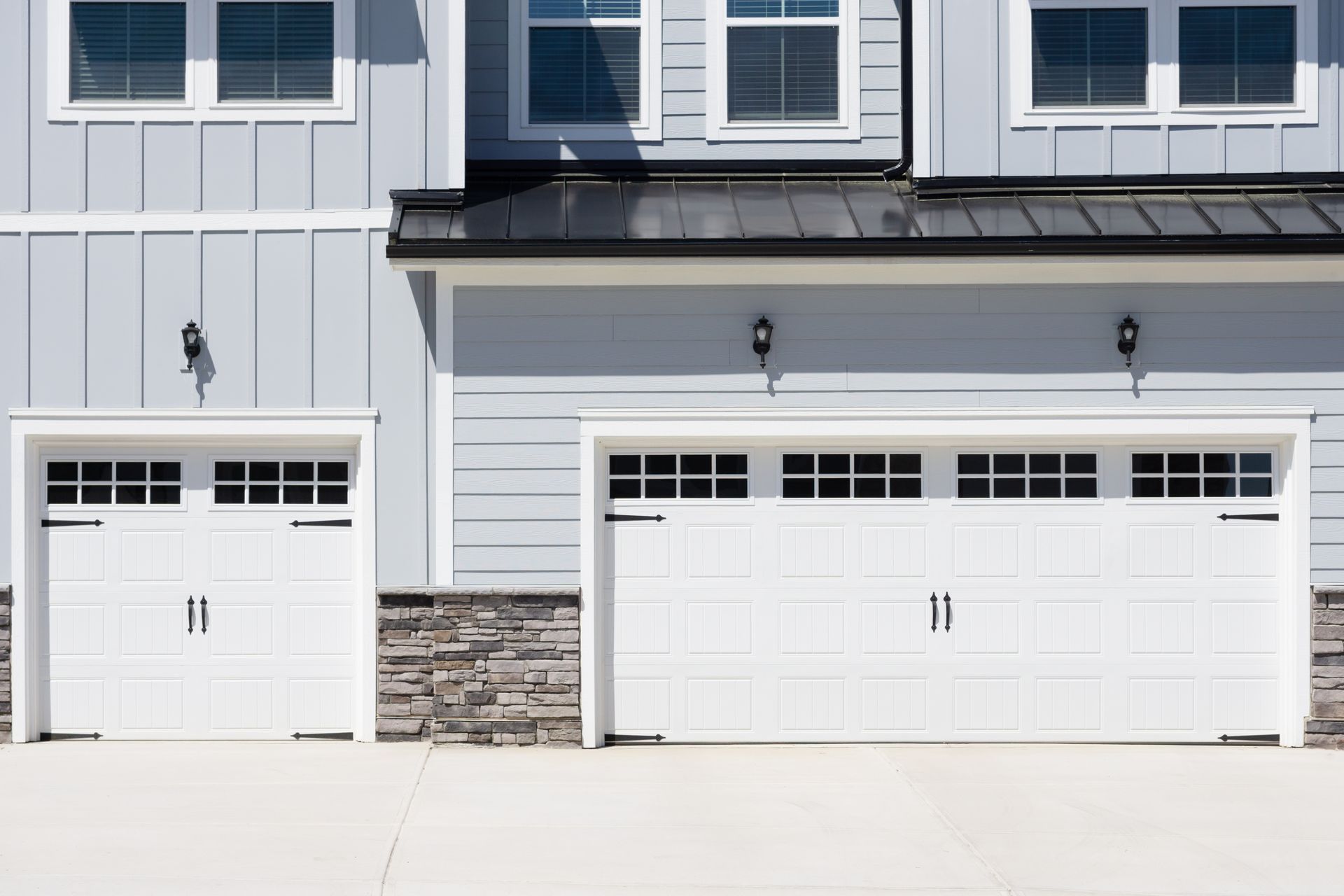 White residential garage door with windows.