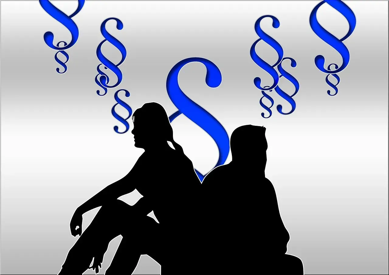 Silhouettes of two seated people with blue paragraph symbols floating above on a gray background