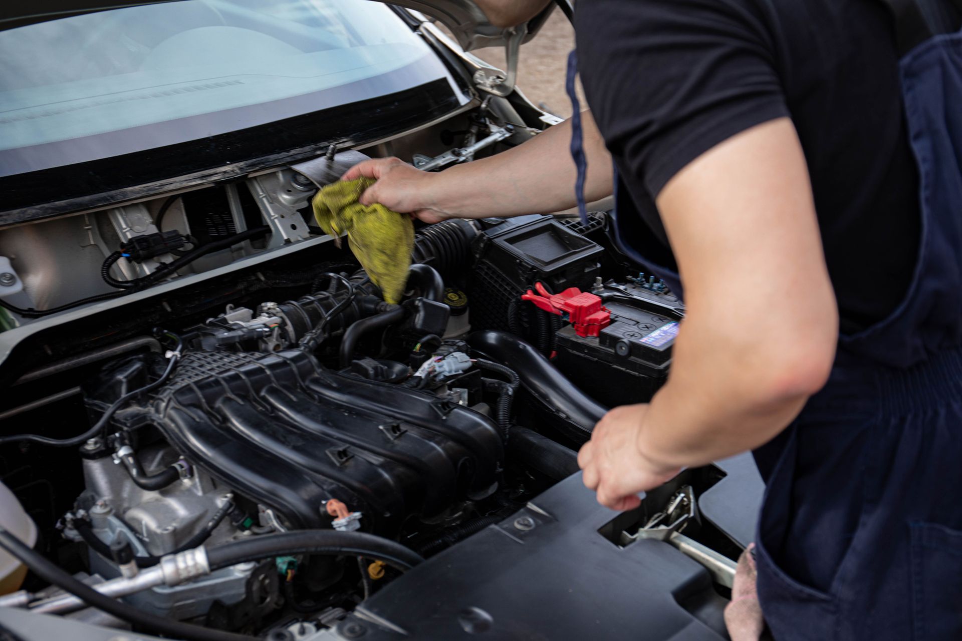 Mechanic Performing Engine Bay Service | Knost Tire & Automotive