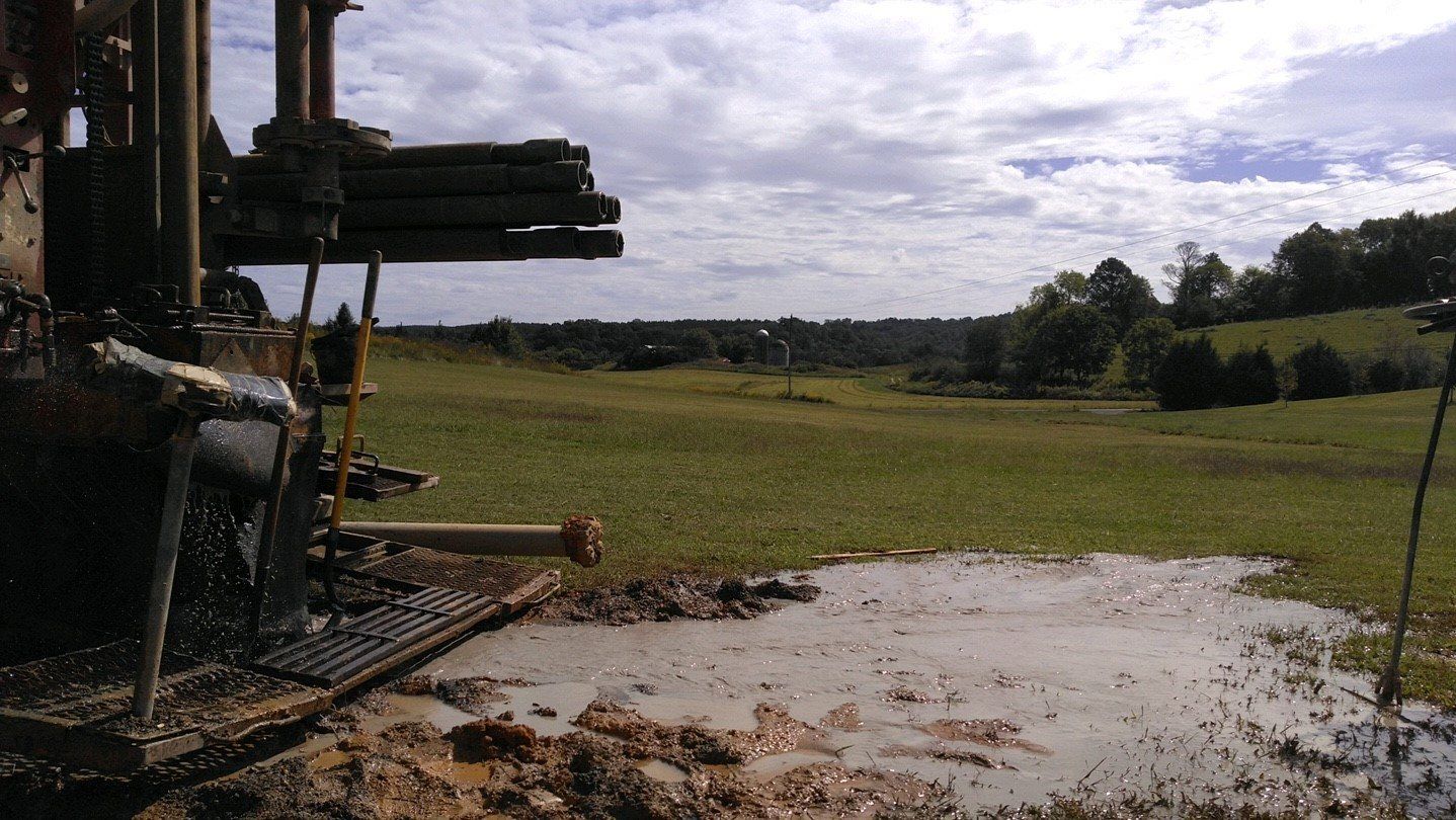 Worker Hands Working With Pipeline Connections - Cleveland, TN - Calfee Clyde & Sons Well Drilling Inc.