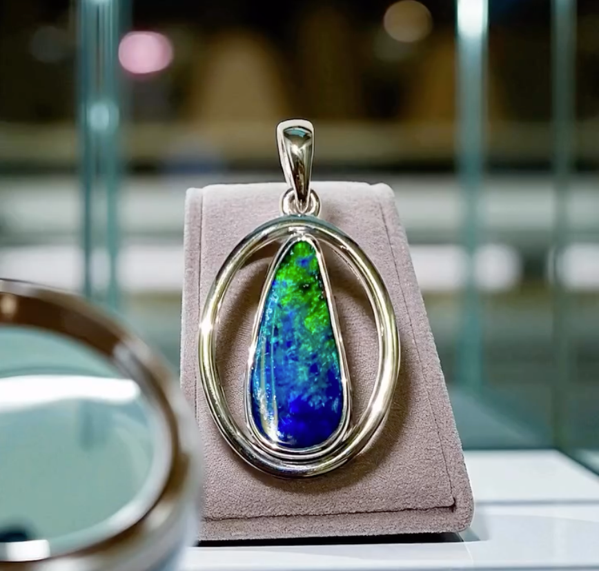 Pendant With an Opal Gemstone Surrounded by Diamonds — Regency Jewellers in Cairns City, QLD