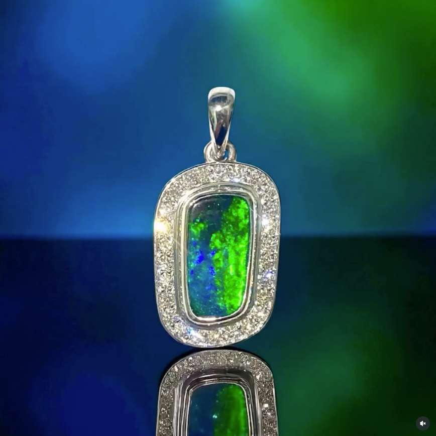 Pendant With an Opal Gemstone Surrounded by Diamonds — Regency Jewellers in Cairns City, QLD