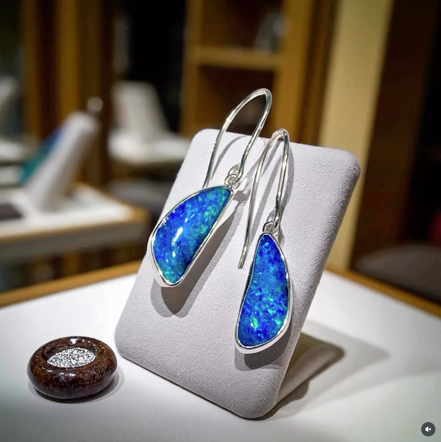 Ring With Pear-shaped Black Opal, Displaying Vibrant Blue, Green, and Red Hues — Regency Jewellers in Cairns City, QLD